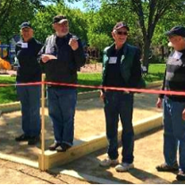 Four men at new bocce ball courts