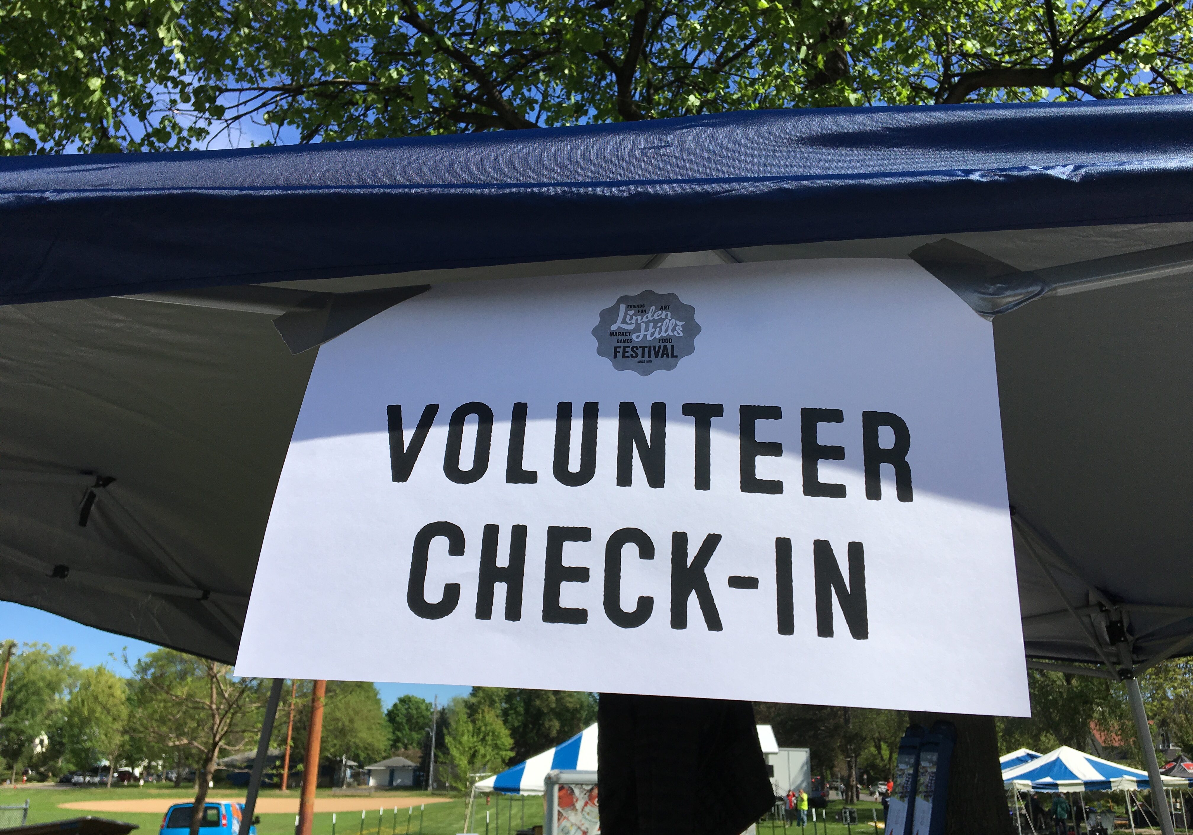 Volunteer Check-in sign at Linden Hills Festival